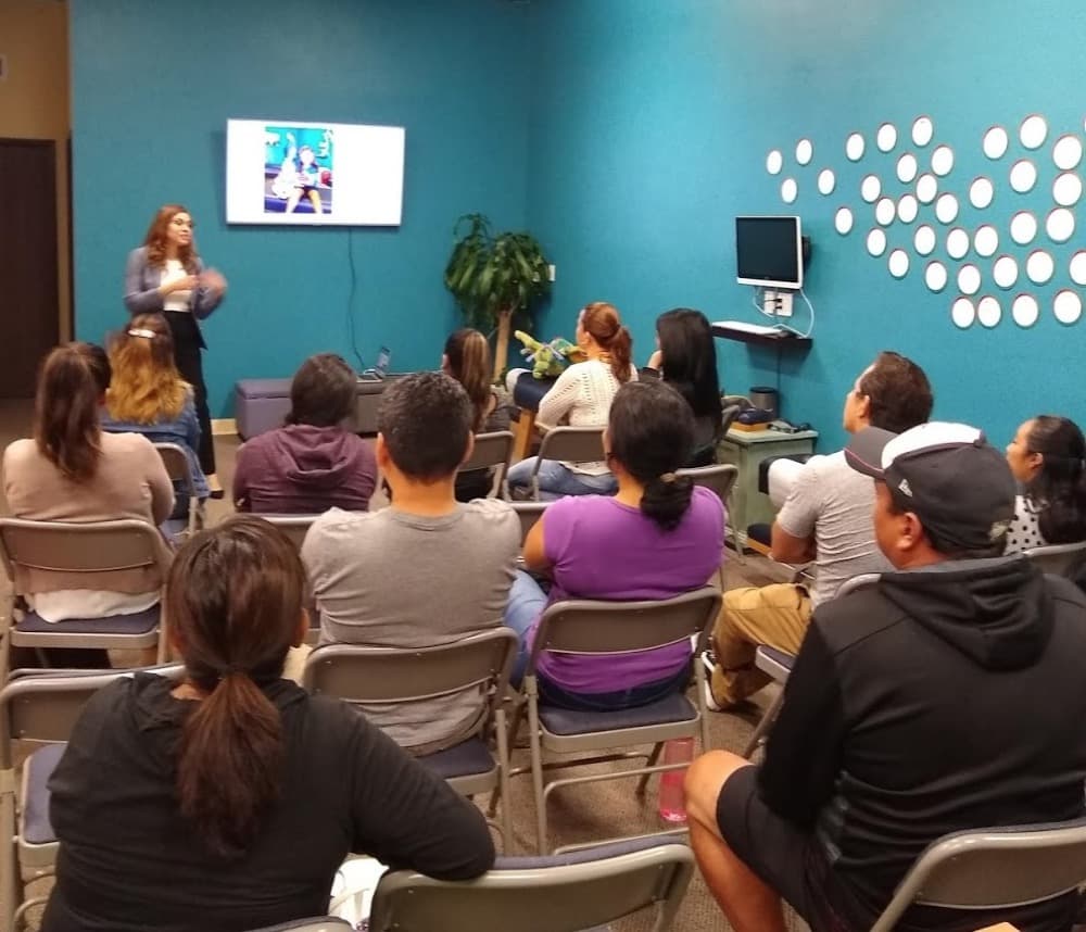 A member presenting to a full room